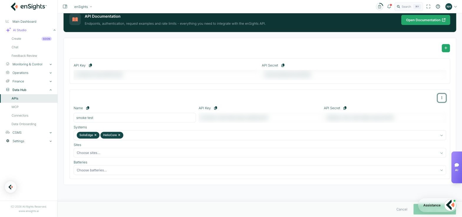 A named API key scoped to two specific systems, with empty Sites and Batteries pickers meaning no restriction on those asset types (key values obscured).