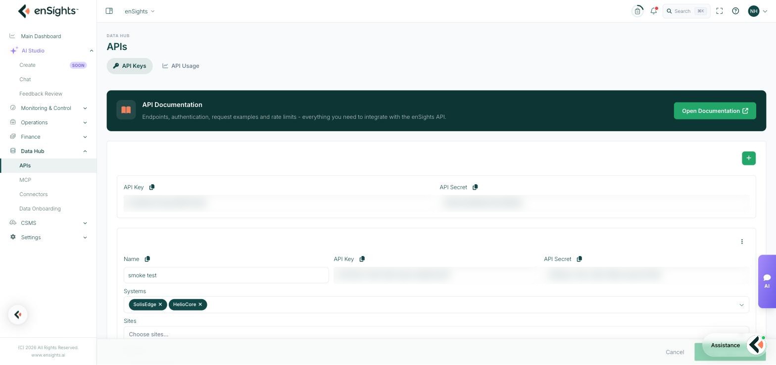 The API Keys tab: the API Documentation banner, the default API key and secret pair, and a named key with its Systems, Sites and Batteries scoping pickers (key values obscured).